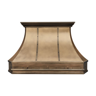 an aged brass range hood