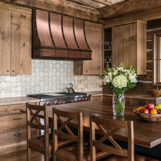 Wooden kitchen with copper range hood