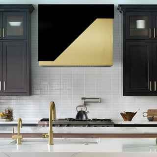 black stainless steel and brushed brass kitchen range hood