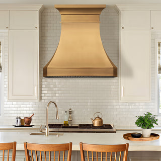 Modern kitchen with brushed brass range hood