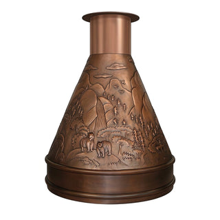 A copper-toned decorative range hood or chimney piece featuring an embossed landscape design with bears, trees, and mountains on the front cone body