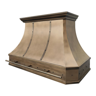right front view of an aged brass range hood