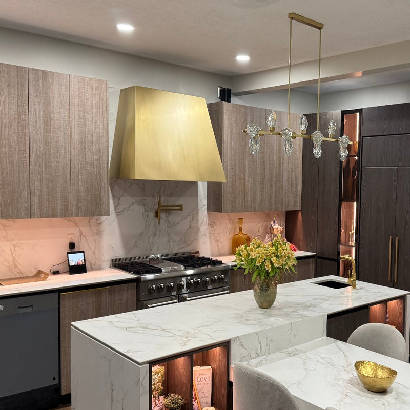 Modern kitchen with marble countertops and stainless steel appliances