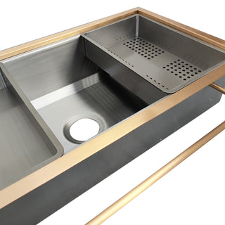 Stainless steel kitchen sink with a perforated strainer 