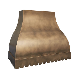 a scalloped  kitchen aged brass wall mount vent hood