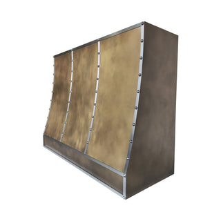 custom aged brass range hood with zinc straps and rivets