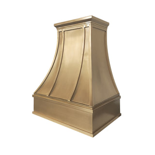 custom brushed brass range hood with a flared, stepped design and decorative paneling