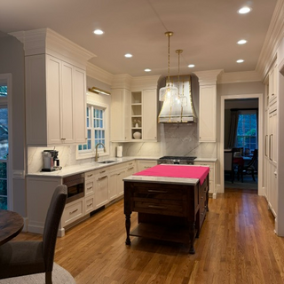 classic stainless steel range hood in traditional kitchen