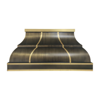 a tiered antique brass range hood with brushed brass straps