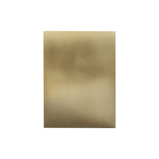 custom brushed brass range hood in modern kitchen