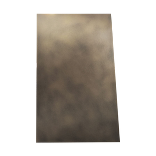Left side view of an aged brass range hood: Smooth rectangular side shape.