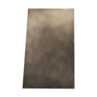 Right side view of an aged brass stove hood: Flat rectangular side profile.