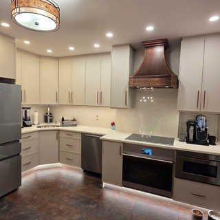 sinda custom classic copper range hood in a modern kitchen