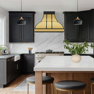 Modern kitchen with SINDA handcrafted brushed brass range hood.