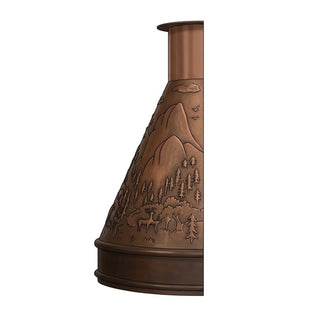 side profile of a copper range hood displaying warm brown finish, and forest landscape design