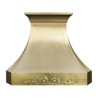 sleek brass range hood with intricate design