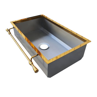 Stainless steel kitchen sink with gold rod