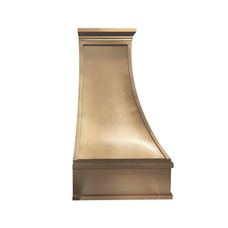 a modern kitchen brushed brass range hood with stepped design