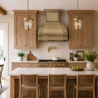a bright, modern kitchen with a luxury brushed brass kitchen range hood