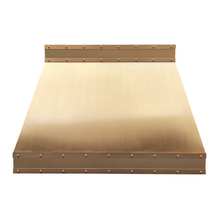 custom brushed brass kitchen range hood with brass straps and round rivets