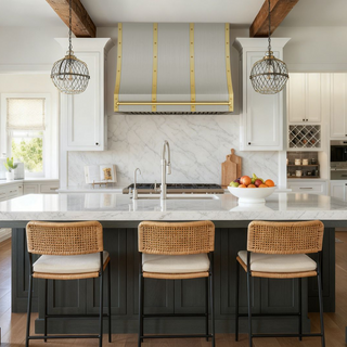 Modern kitchen with brushed brass range hood.