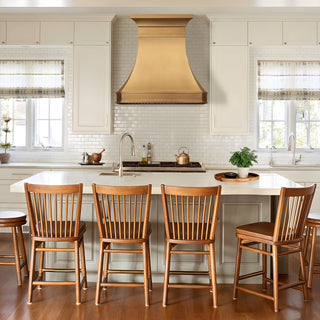 modern kitchen with brushed brass range hood