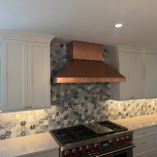 Modern kitchen with copper range hood 