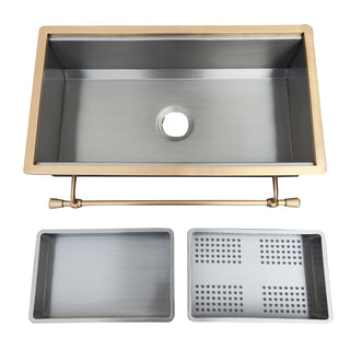 Stainless steel kitchen sink with gold faucet and accessories