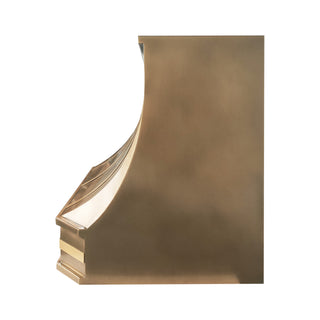 the side of a luxury aged brass range hood with brushed brass straps