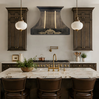 A luxury kitchen interior featuring dark wood cabinetry, a matching antique brass range hood
