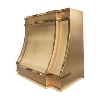 brushed brass range hood with polished brass straps